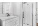 Modern bathroom with white subway tiles, glass enclosed shower, and stylish vanity at 4612 Barracuda Dr, Bradenton, FL 34208