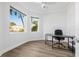 Bright bedroom with two large windows and a modern desk, perfect for a home office at 4612 Barracuda Dr, Bradenton, FL 34208