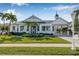 Charming single-story home with a well-manicured lawn and palm trees accenting the front yard at 4612 Barracuda Dr, Bradenton, FL 34208