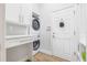 Well-equipped laundry room with modern appliances, countertop, and storage cabinets at 4612 Barracuda Dr, Bradenton, FL 34208