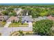 An aerial view showcases this lovely home, nestled among trees and landscaping within a quiet neighborhood at 4951 Musselshell Dr, New Port Richey, FL 34655