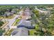 Bird's-eye view of a home featuring a screened-in pool and spacious backyard within a residential area at 4951 Musselshell Dr, New Port Richey, FL 34655