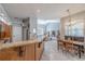 Open concept kitchen and dining area with wood cabinets and lots of light at 4951 Musselshell Dr, New Port Richey, FL 34655