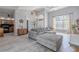 Bright living space featuring vaulted ceilings, and a seamless transition to dining and kitchen areas at 4951 Musselshell Dr, New Port Richey, FL 34655