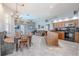 Open-concept living space seamlessly connects the dining area, living room, and kitchen, perfect for gatherings at 4951 Musselshell Dr, New Port Richey, FL 34655