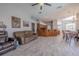 Open concept living room showcasing hardwood flooring, an island, and neutral paint at 4951 Musselshell Dr, New Port Richey, FL 34655