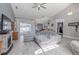 Spacious living room with vaulted ceilings, fireplace and sliding glass doors offer natural light and style at 4951 Musselshell Dr, New Port Richey, FL 34655