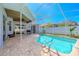 Exterior view of pool and patio featuring a grill and outdoor furniture, ideal for entertaining at 4951 Musselshell Dr, New Port Richey, FL 34655
