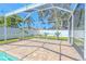 Enjoy this brick-paved screened-in patio with a full pool view perfect for entertaining and relaxation at 4951 Musselshell Dr, New Port Richey, FL 34655
