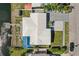 Aerial view of a single-Gathering home with a well-maintained lawn, dock, and waterfront access at 5816 Liverpool Dr, Tampa, FL 33615