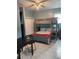 Bedroom featuring a bunk bed, desk, dresser, and a bright window at 5816 Liverpool Dr, Tampa, FL 33615