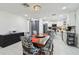 Well-lit dining area showcasing modern decor, kitchen access, and ample space at 5816 Liverpool Dr, Tampa, FL 33615