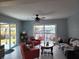 Relaxing living room featuring bright decor, a ceiling fan, and serene water views at 5816 Liverpool Dr, Tampa, FL 33615