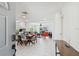 Bright, open-concept living space with modern white tile flooring and an inviting layout at 5816 Liverpool Dr, Tampa, FL 33615
