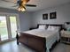 This main bedroom is well-lit and features neutral walls and flooring plus sliding glass door access to the outside at 5816 Liverpool Dr, Tampa, FL 33615