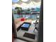 Cozy outdoor patio with comfortable seating and a view of the waterfront at 5816 Liverpool Dr, Tampa, FL 33615