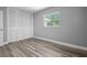 This bedroom features new wood floors, fresh paint and a closet at 660 Palm Ave, Tarpon Springs, FL 34689
