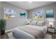 Relaxing bedroom with neutral colors, soft bedding, and natural light streaming in from the surrounding nature at 660 Palm Ave, Tarpon Springs, FL 34689