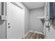 Utility room showcasing a door, water heater and new floors at 660 Palm Ave, Tarpon Springs, FL 34689