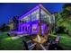 Beautifully lit backyard with a pool, spa, fire pit, and lounge area for outdoor relaxation at 721 Brightwaters Ne Blvd, St Petersburg, FL 33704