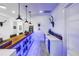 A bar with wood countertop and blue LED lighting at 721 Brightwaters Ne Blvd, St Petersburg, FL 33704