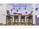 Stylish bar area with wooden countertop, seating for four, and unique decorative elements at 721 Brightwaters Ne Blvd, St Petersburg, FL 33704
