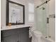 This is a bathroom that has a vanity with a mirror and a glass enclosed shower at 721 Brightwaters Ne Blvd, St Petersburg, FL 33704