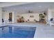 This open entertainment space is adjacent to the pool and features comfortable seating and a custom bar at 721 Brightwaters Ne Blvd, St Petersburg, FL 33704