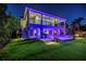 Elegant two-story home featuring a backyard oasis with a pool, spa, and ambient lighting at 721 Brightwaters Ne Blvd, St Petersburg, FL 33704