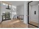 Elegant home foyer featuring high ceilings, an antler chandelier, and an elevator at 721 Brightwaters Ne Blvd, St Petersburg, FL 33704