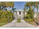 Beautiful home with a gated entry and palm tree landscaping at 721 Brightwaters Ne Blvd, St Petersburg, FL 33704