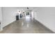 Wide garage with smooth concrete floors for vehicle and equipment storage at 721 Brightwaters Ne Blvd, St Petersburg, FL 33704