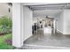Spacious garage with high ceilings, plenty of room for storage, and access to the backyard at 721 Brightwaters Ne Blvd, St Petersburg, FL 33704