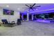 Contemporary living area with sleek furnishings, waterfront view and TV at 721 Brightwaters Ne Blvd, St Petersburg, FL 33704