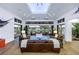 Open-concept living room with waterfront views, comfortable seating, and natural light at 721 Brightwaters Ne Blvd, St Petersburg, FL 33704