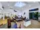 Well-lit open-concept living room with waterfront views and easy access to outdoor entertaining and other spaces at 721 Brightwaters Ne Blvd, St Petersburg, FL 33704
