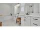 A main bathroom with dual vanities and a makeup area at 721 Brightwaters Ne Blvd, St Petersburg, FL 33704