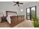 This is a bright main bedroom featuring a wooden floor, light colored walls, and trim at 721 Brightwaters Ne Blvd, St Petersburg, FL 33704