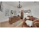 Comfortable home office with leather chairs, a rustic desk, and themed décor for a relaxed workspace at 721 Brightwaters Ne Blvd, St Petersburg, FL 33704