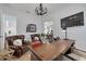 Cozy home office featuring a rustic wooden desk, leather chairs, and themed artwork at 721 Brightwaters Ne Blvd, St Petersburg, FL 33704
