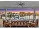 Waterfront patio with comfortable seating, perfect for enjoying stunning sunset views over the water at 721 Brightwaters Ne Blvd, St Petersburg, FL 33704