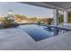 View of custom swimming pool, outdoor living area, and boat dock at 721 Brightwaters Ne Blvd, St Petersburg, FL 33704