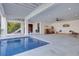 This custom pool sits adjacent to an open entertainment area, adding luxury to a home's outdoor living space at 721 Brightwaters Ne Blvd, St Petersburg, FL 33704