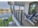 Relaxing porch with Adirondack chairs overlooking the waterfront and lush green lawn at 721 Brightwaters Ne Blvd, St Petersburg, FL 33704