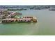 Stunning aerial view of waterfront condos with lush landscaping and ocean views at 7645 Sun Island S Dr # 207, South Pasadena, FL 33707