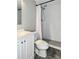 Bathroom features a white single sink vanity, toilet, and shower with a rainfall shower head at 7645 Sun Island S Dr # 207, South Pasadena, FL 33707