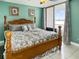 Stylish bedroom with comfortable furnishings and a view of the waterfront at 7645 Sun Island S Dr # 207, South Pasadena, FL 33707