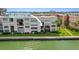 Beautiful waterfront condo with lush green lawn and tropical landscaping at 7645 Sun Island S Dr # 207, South Pasadena, FL 33707