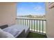 An outdoor seating area on a lanai offers an expansive water view of the surrounding area and community at 7645 Sun Island S Dr # 207, South Pasadena, FL 33707