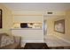 The living room features a sofa and views into the kitchen area with tile flooring at 7645 Sun Island S Dr # 207, South Pasadena, FL 33707